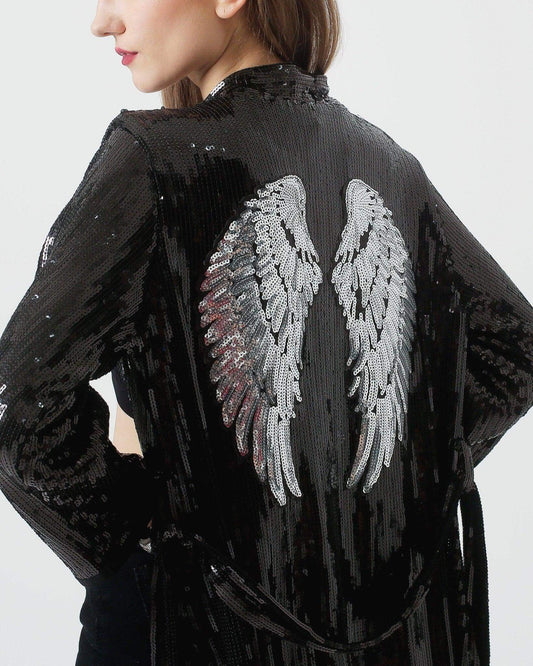 Black Sequin Kimono with Silver Wings by Festivo Kimonos. black sequin fabric, silver wings on the back and a flowing fringe hem.